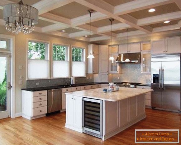 Design of a large kitchen in a private house - a photo of a kitchen island