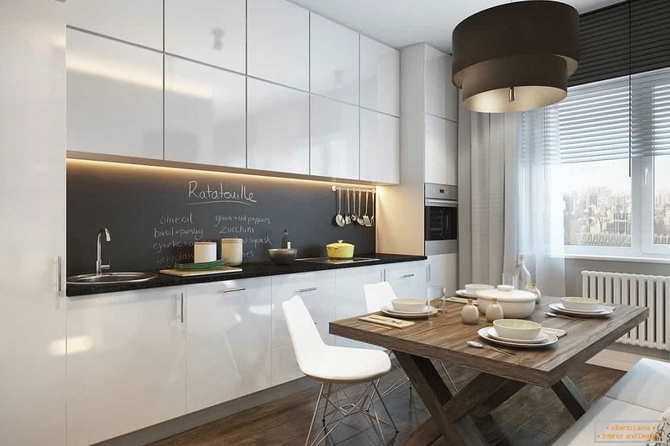 White cabinet with a black apron in the kitchen with a window