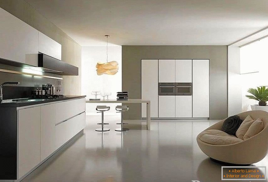 Modern spacious kitchen with a soft armchair