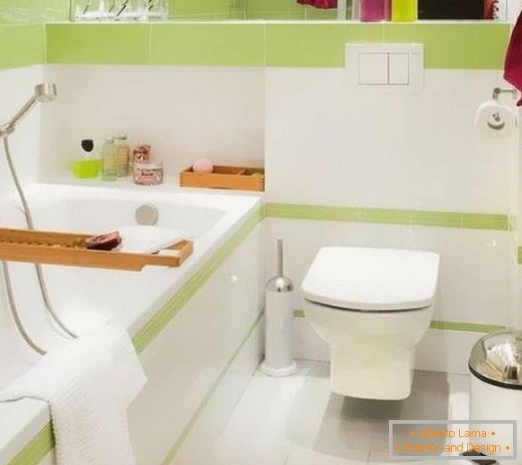Small combined bathroom with white-green tiles
