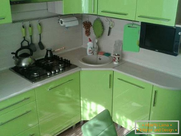 Interior of green kitchen in the design of a small apartment of 30 sq m