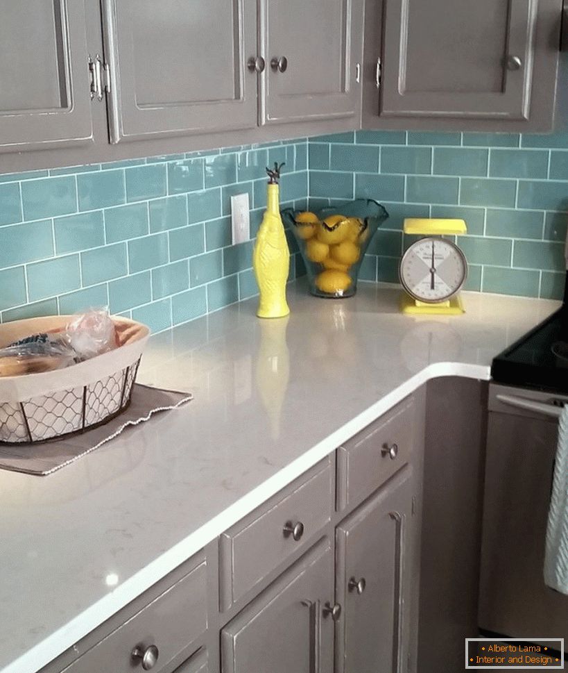 Turquoise apron and gray furniture in the kitchen