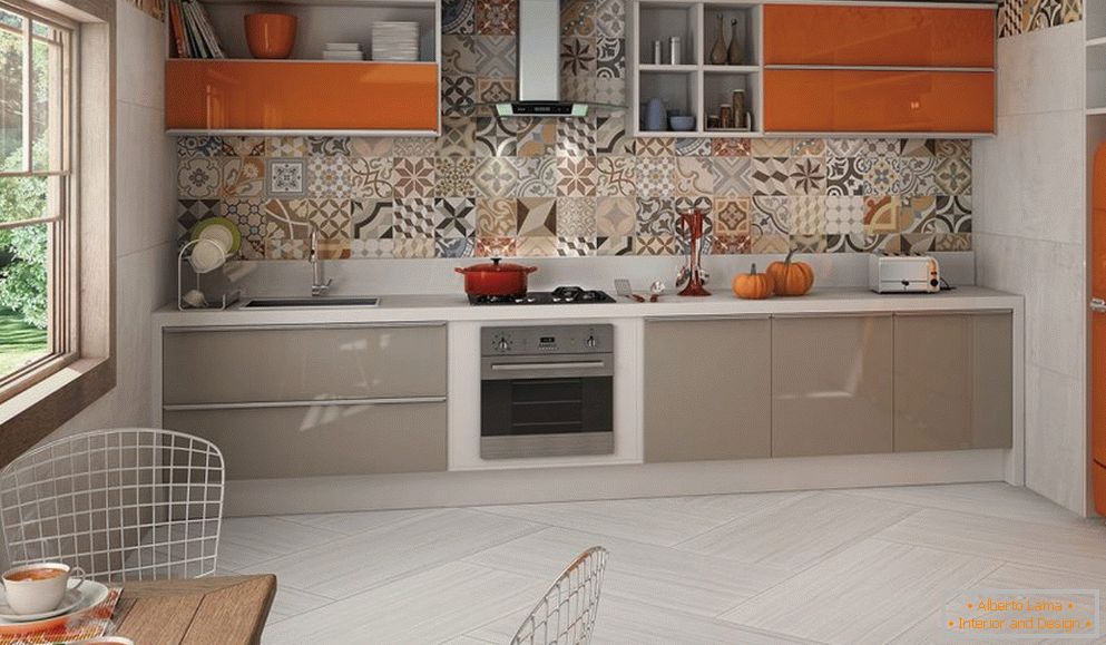 Gray-orange furniture in a light kitchen interior