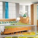 Shades of green and yellow in the design of the bedroom