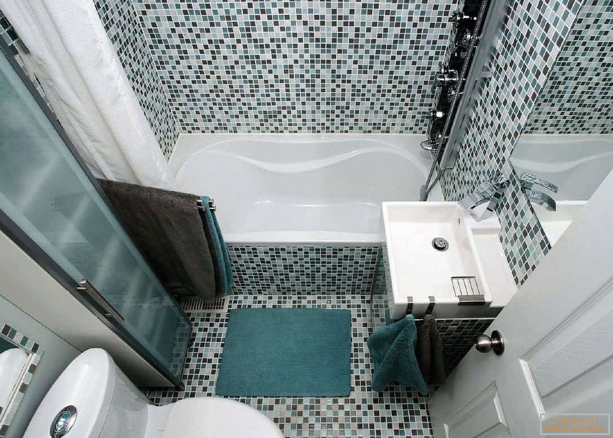 Bathroom in a panel house decorated with mosaic