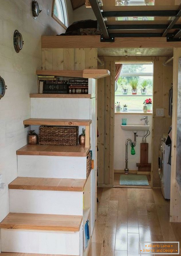 A house on wheels for a family. Storage system in steps