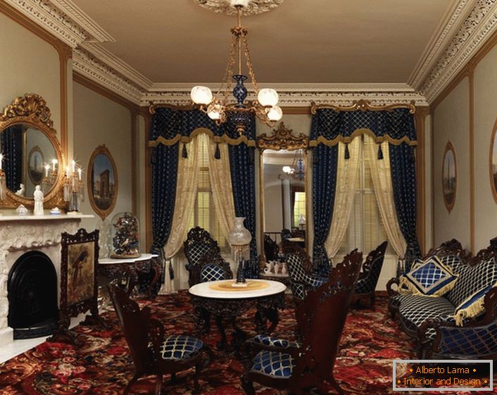 Upholstery furniture and curtains are made from one fabric in a dark blue cage. In the best traditions of the Baroque style, the interior elements are decorated with gold elements.