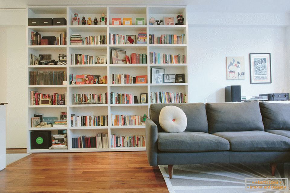 Bookcase in the living room of the stylish duplex in Manhattan