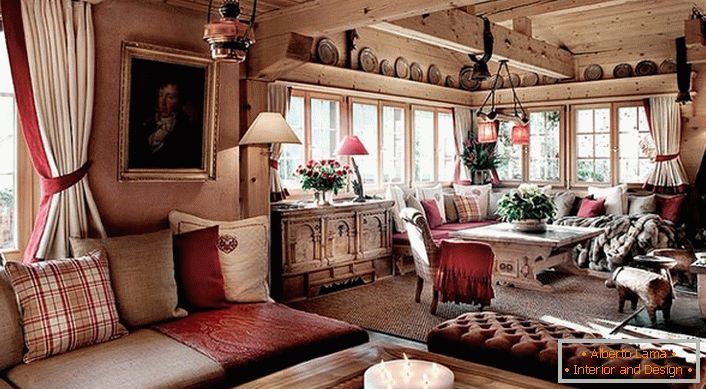 Accents of red color in the chalet-style room make the room romantic and aesthetically attractive. 