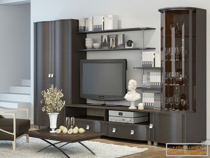 Stylish solution for the living room. Wenge furniture is combined with a laminate that mimics a tree.