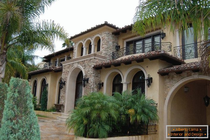Arched openings are an important feature of the Mediterranean style. Exotic plants are used to design the landscape design.