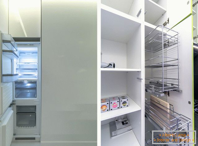 Modern refrigerator in the interior of the kitchen