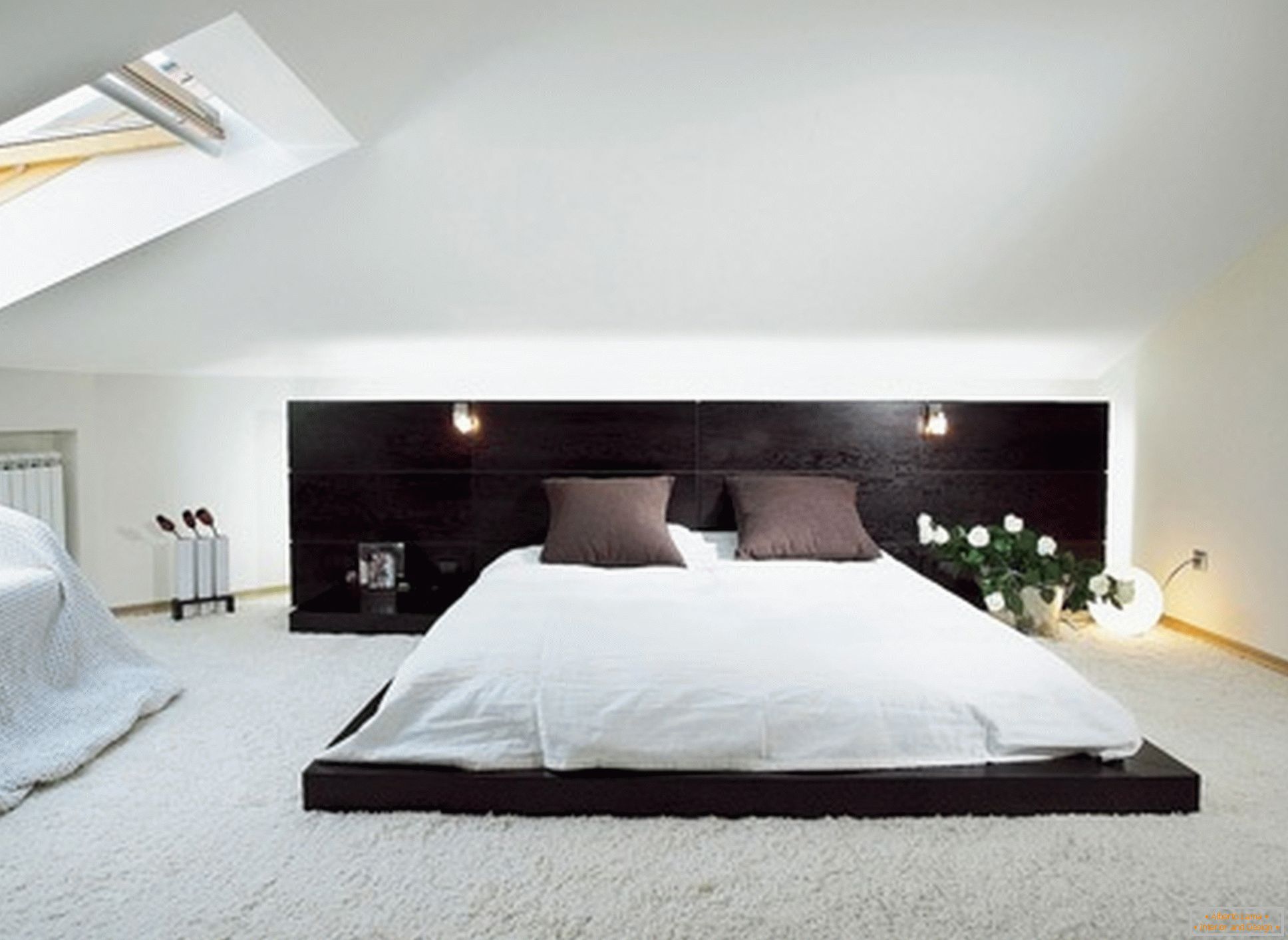 Luxurious bedroom in the style of minimalism - an example of a successful design of a small room on the attic floor.