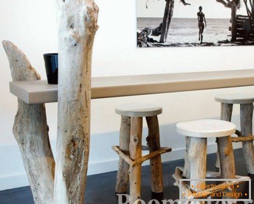 Stools and table with legs from tree trunks