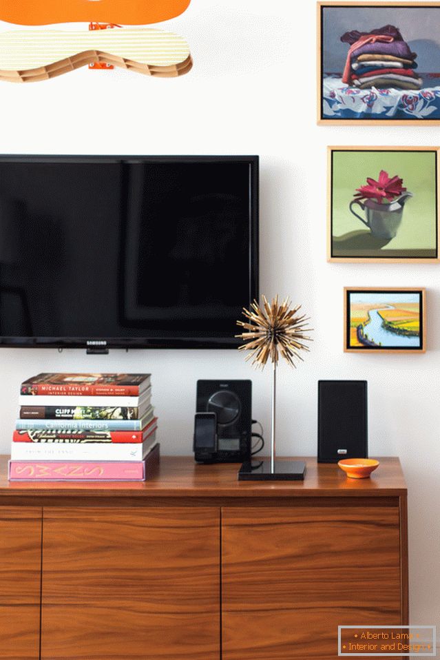 TV above the console in the living room of a small apartment in San Francisco