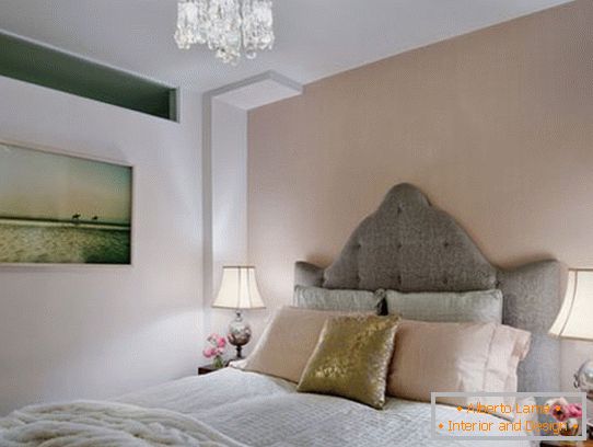 Bed with an elegant headboard in the bedroom