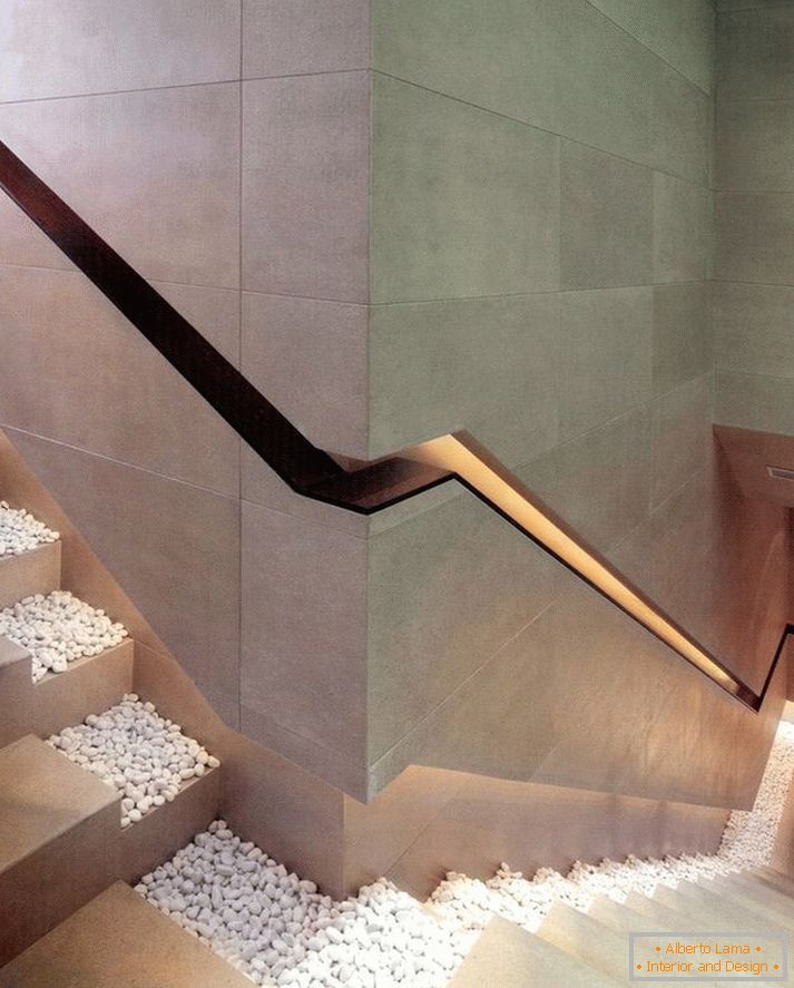 Staircase with lighting-handrail in the wall