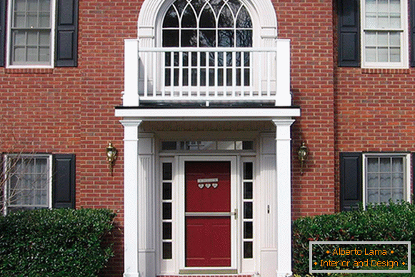 White stucco against the red brick facade