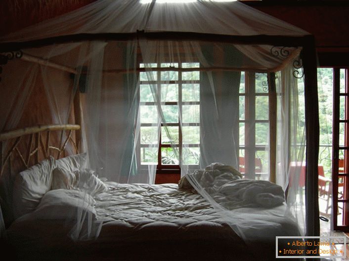 Transparent, thin canopy in the bedroom of a country house in the south of Italy.