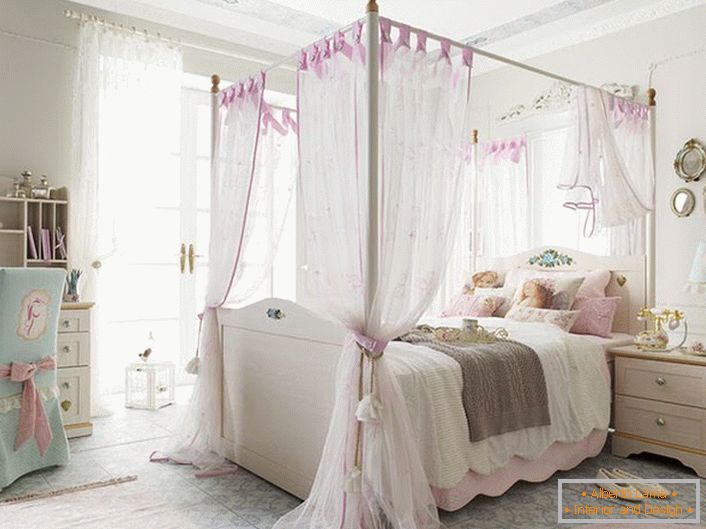 Delicate interior design in the room of a young lady. A semi-transparent canopy during daytime sleep will dim the sunlight.
