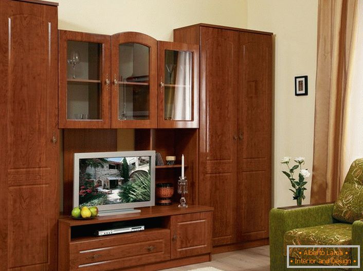 Wall for living room in classic style. Modular furniture of light brown color is capacious and practical. 