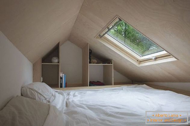 Bedroom under the ceiling in a country house on wheels