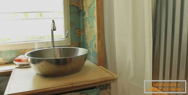 Van-house on wheels: a sink made of metal
