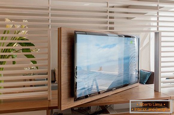 The idea of ​​a revolving bedside table for a TV