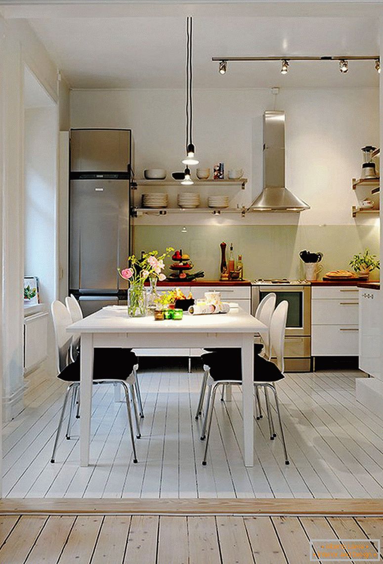 retro-white-design-for-a-small-kitchen-plus-track-lighting-also-black-dining-chair-pads-design