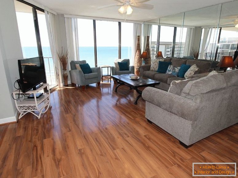 beautifully-decorated-living-room-with-balcony-access-cant-beat-the-water-view