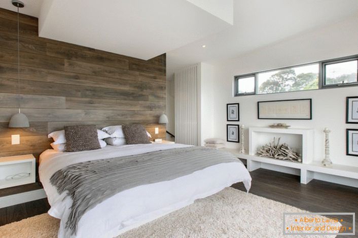 A stylish bedroom in rustic country. The functionally designed space is not cluttered with unnecessary details. The bedroom is the right example of a family home.