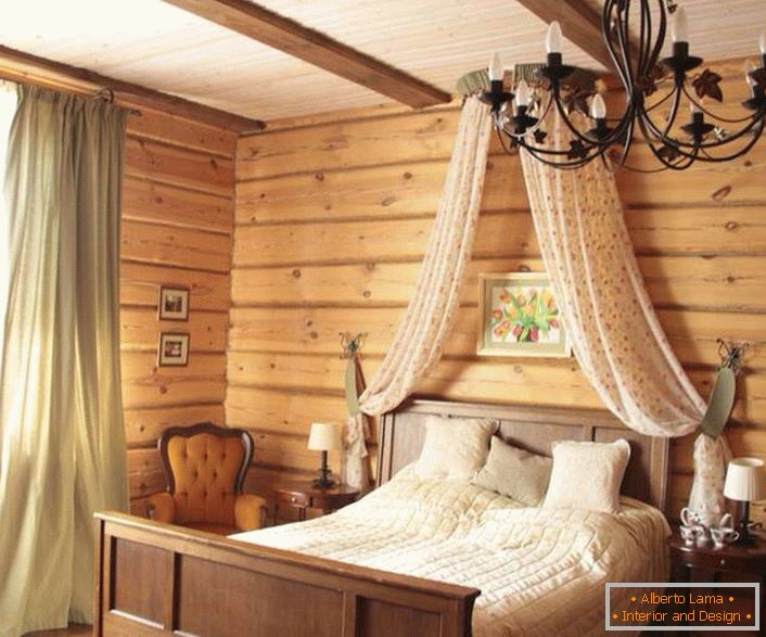 Baldachin above the bed in the bedroom in a rustic style.