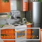 Kitchen with orange furniture