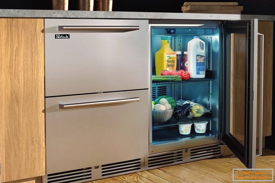 Refrigerator under the work area in the kitchen