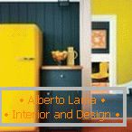 The combination of a gray wall and a yellow refrigerator