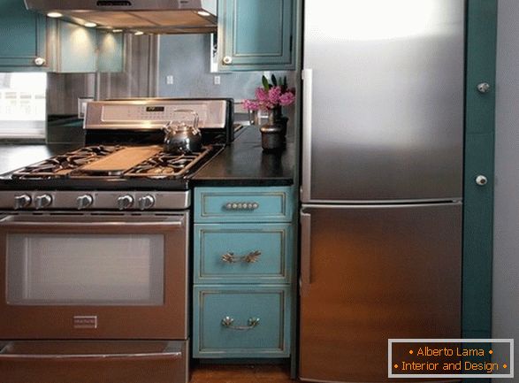 Steel appliances in the turquoise kitchen