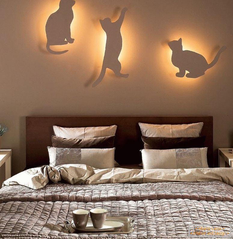 Cats with lights on the wall