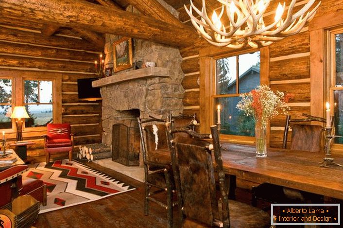 A stylish design of a hunting lodge in a rustic style creates an atmosphere of home comfort.