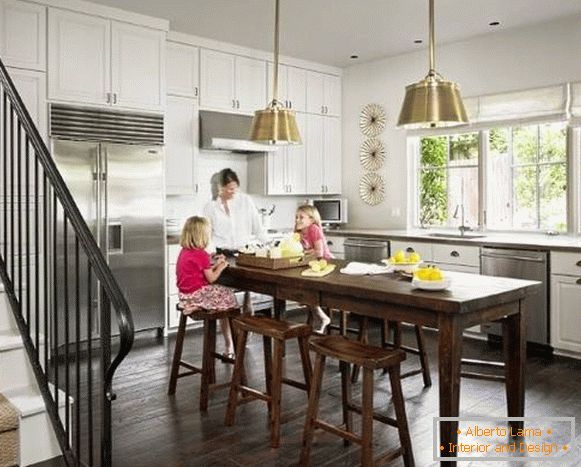 Wooden table island for kitchen photo