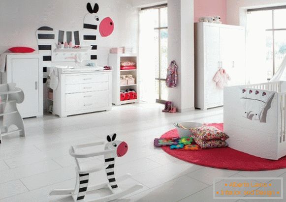 The spacious interior of the children's bedroom in white tones