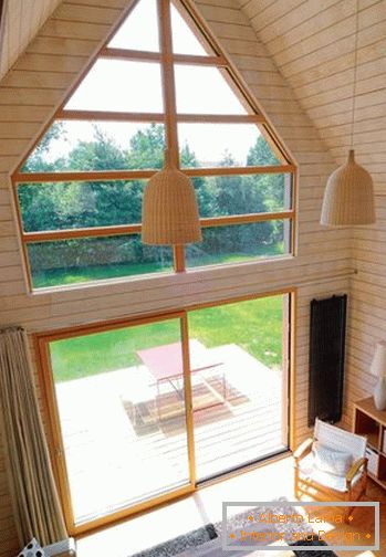 Glass window and doors in a small wooden house