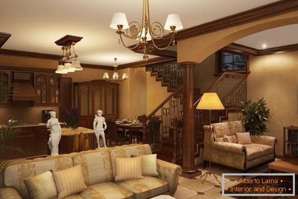 Photo of the kitchen interior of the living room in a private house with a staircase to the second floor