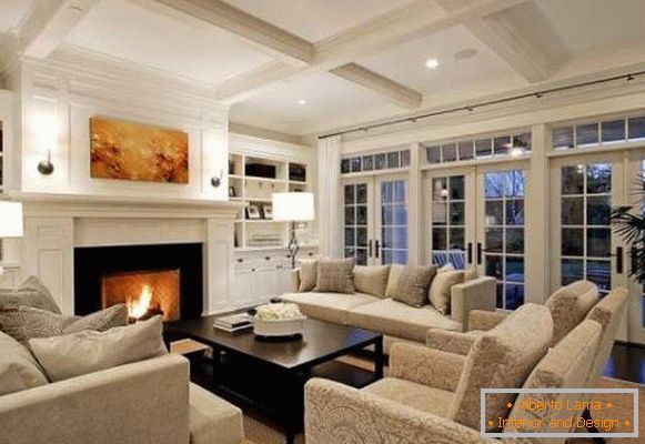 Interior of living room with fireplace in the design of a country house