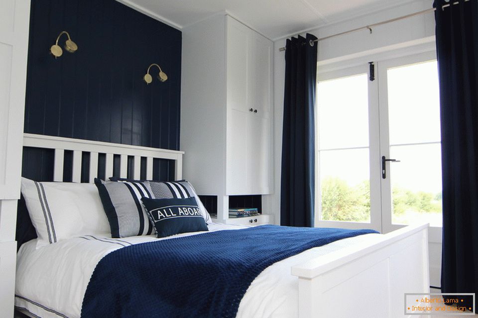 Dark blue accents in the white bedroom