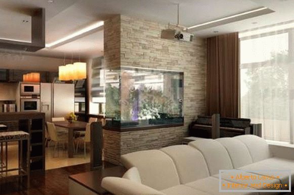 The interior of the living room kitchen with an aquarium partition between them