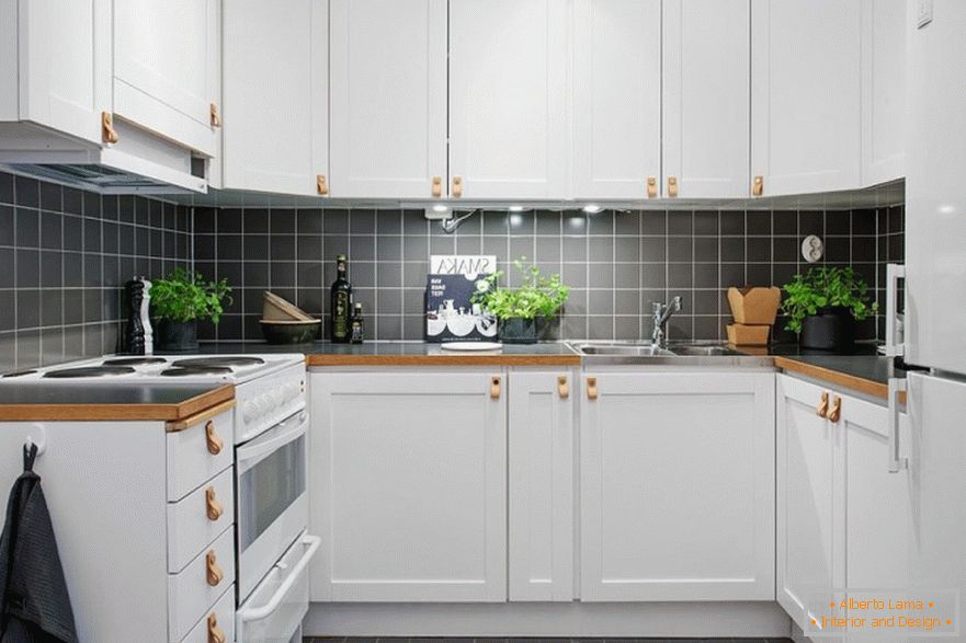 Black accents in the interior of a small white kitchen