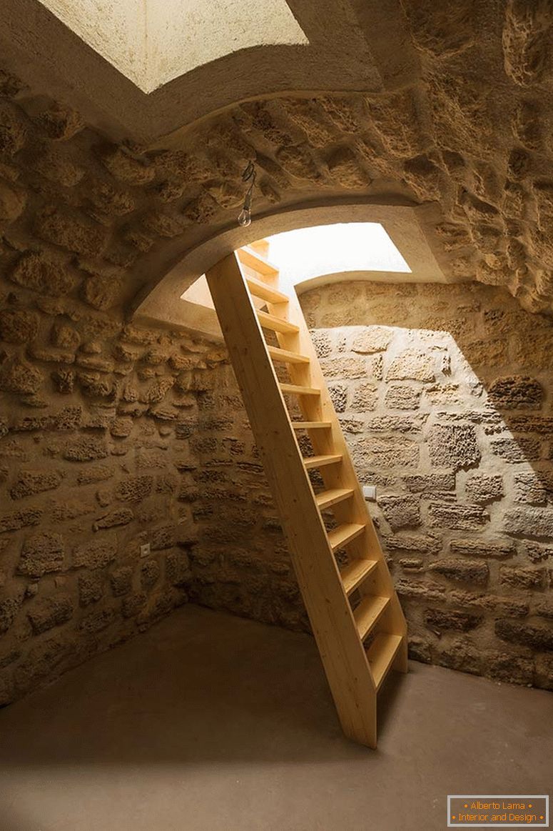 A wide wooden staircase to the basement