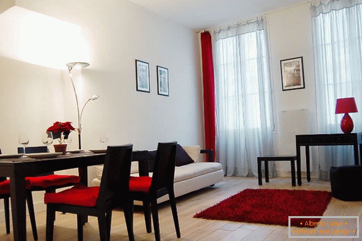 Bright interior of the living room with red and black accents