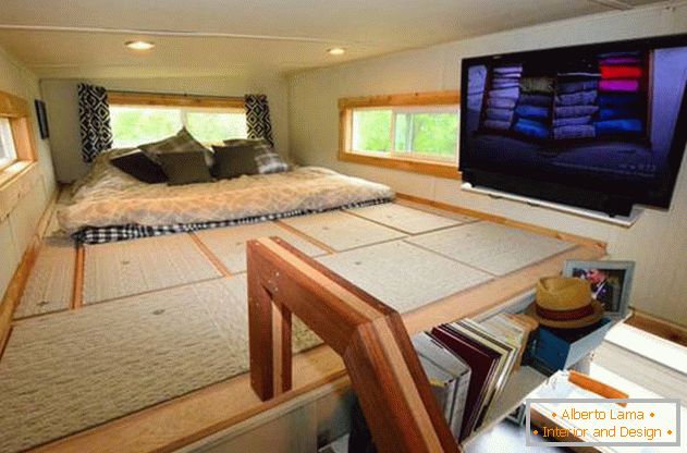 Bedroom under the ceiling in a small country house