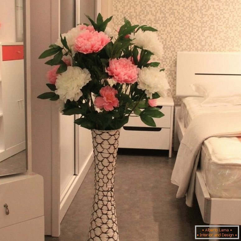 Artificial peonies in the bedroom